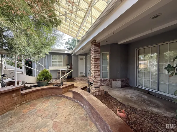 an aerial view of a house with outdoor space