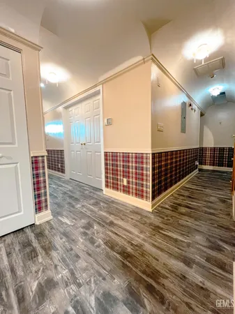 a dining hall with stainless steel appliances kitchen island granite countertop furniture and a kitchen view