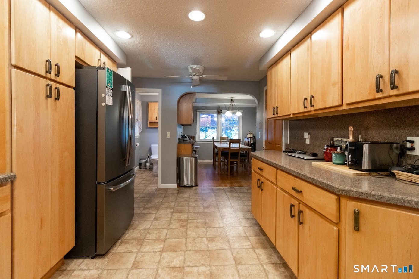 763 North Street Suffield, CT 06078 - Photo 12 of 40 a large kitchen with stainless steel appliances granite countertop a refrigerator and a sink