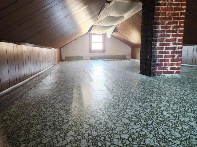 a view of an empty room with windows