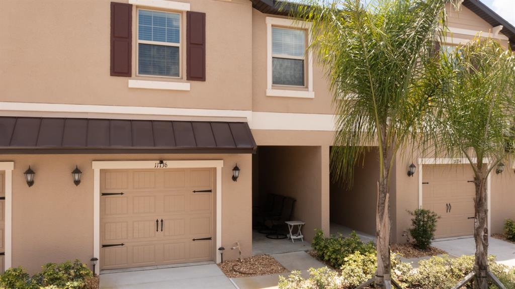 11736 Castine Street New Port Richey, FL 34654 - Photo 1 of 1 a view of front door and potted plants