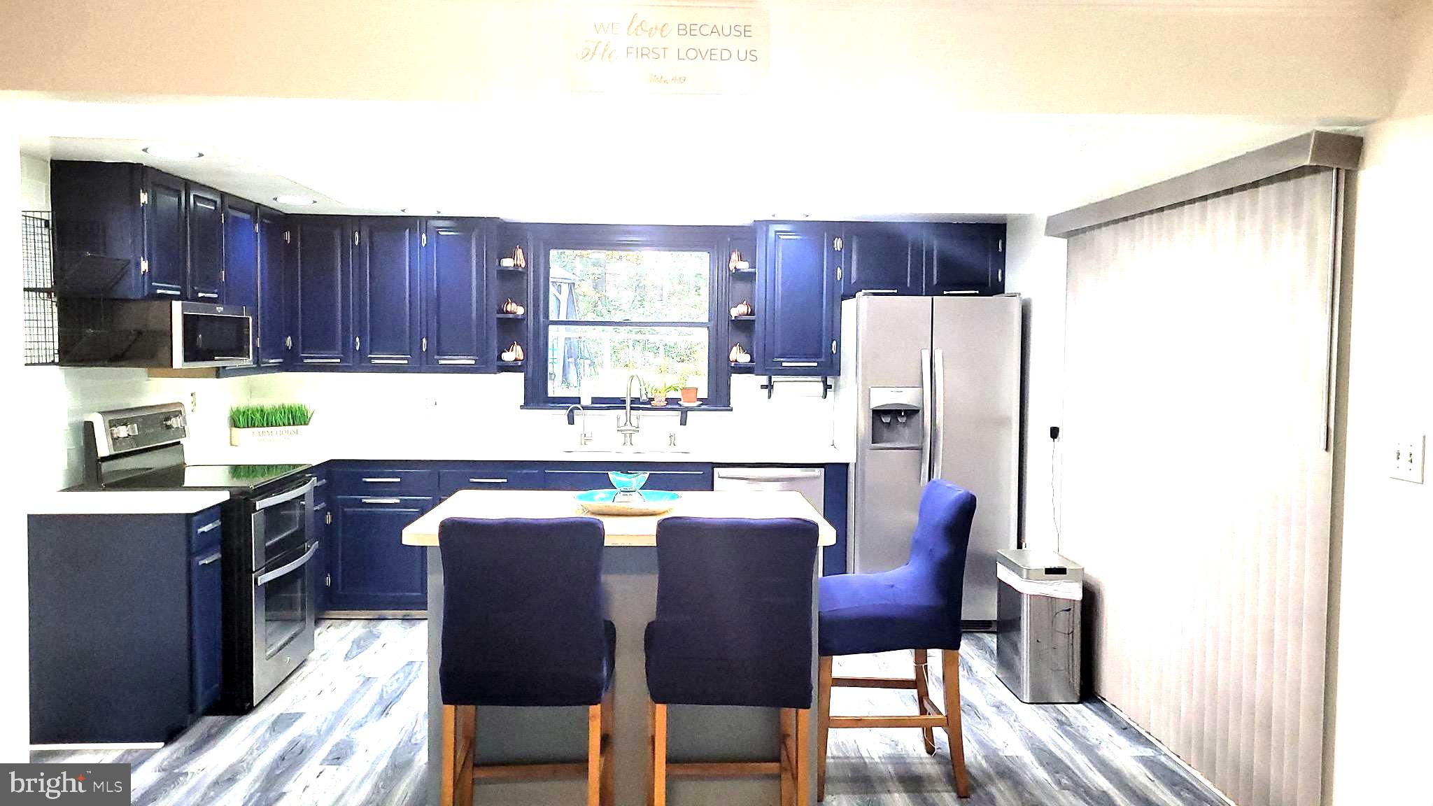 1815 Manchester Road Westminster, MD 21157 - Photo 2 of 45 Modern kitchen with navy cabinetry.