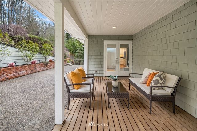 a bathroom with a toilet a sink a vanity and mirror