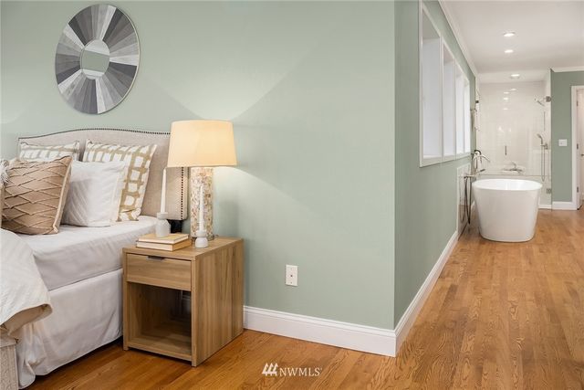 a spacious bathroom with a bathtub and sink