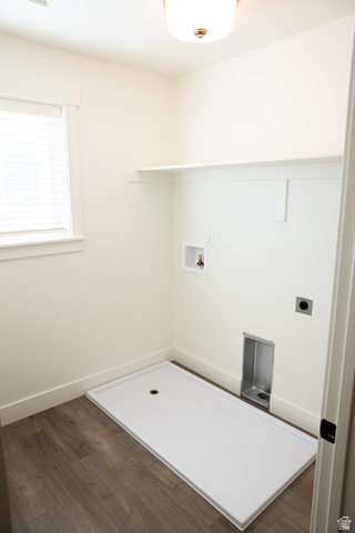 2218 South 635 West, Unit A Perry, UT 84302 - Photo 11 of 18 Laundry area featuring wood-finish flooring, white walls, overhead lighting, a window with blinds, and built-in shelving