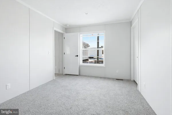 a view of a room that has a window in it