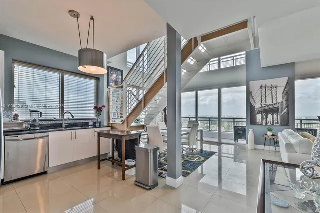 a kitchen with stainless steel appliances granite countertop a stove and cabinets