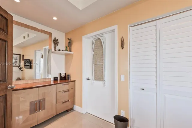 a bathroom with a double vanity sink a mirror and a shower