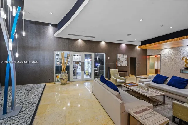 a lobby with furniture and window