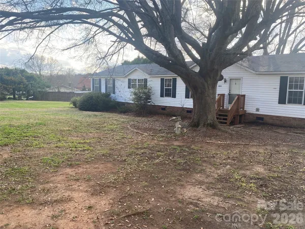 a house view with a backyard space