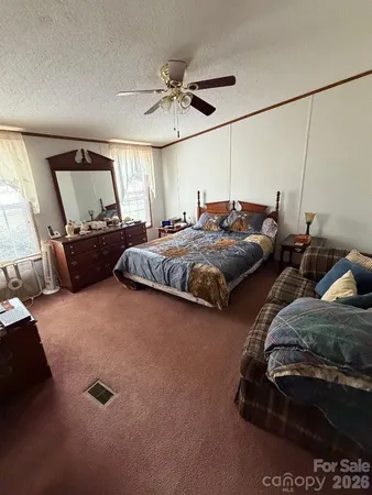 a bed room with two bed and a couch