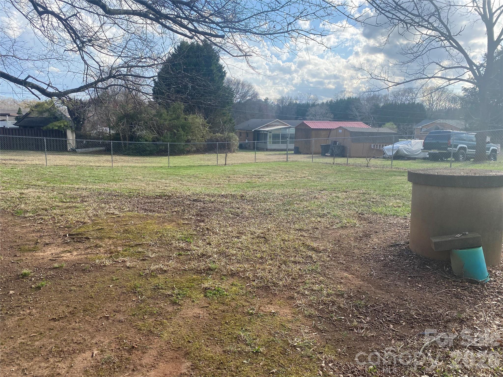 1011 Kiser Dairy Road Dallas, NC 28034 - Photo 12 of 17 a view of a green field with wooden fence