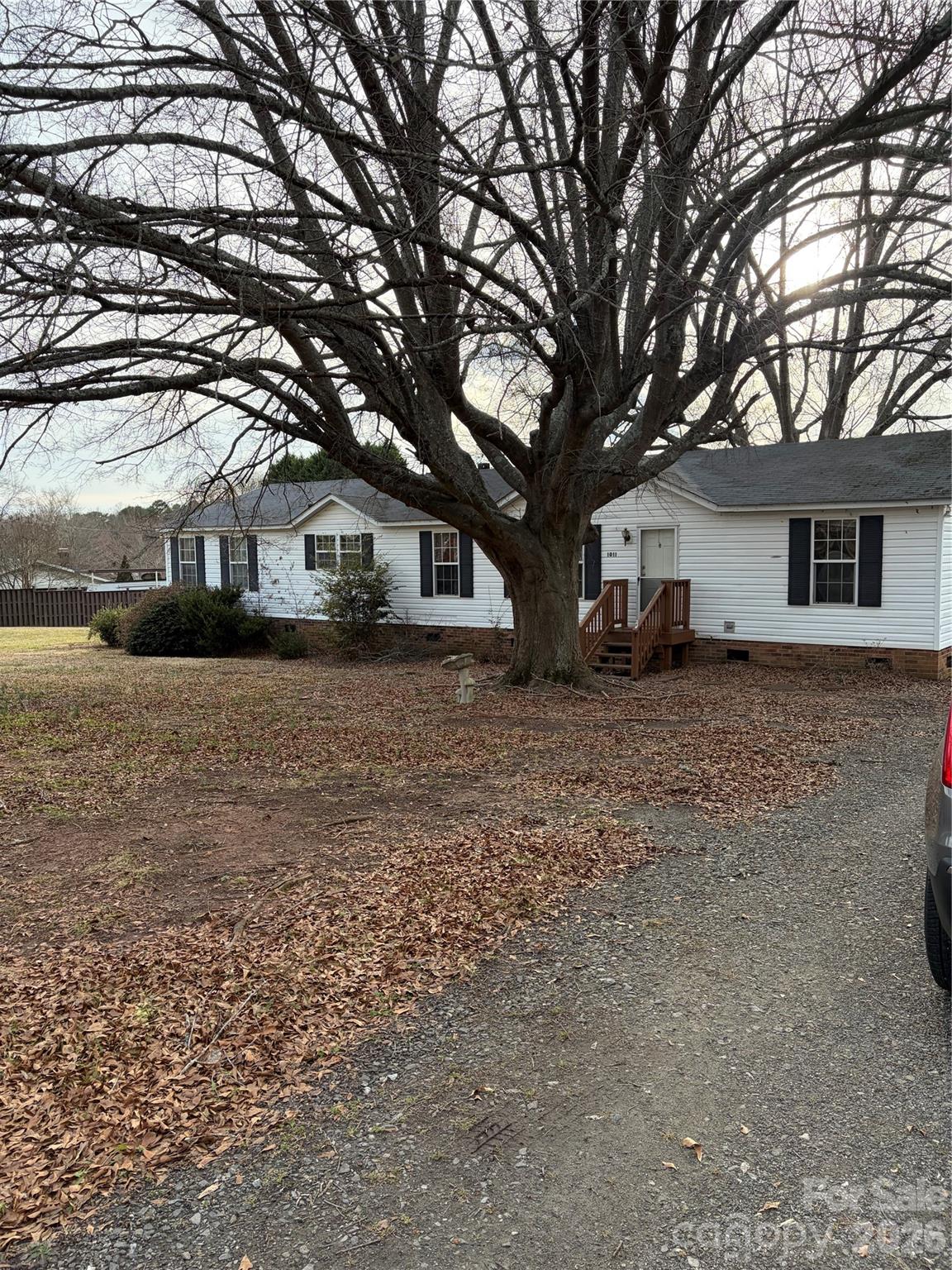 1011 Kiser Dairy Road Dallas, NC 28034 - Photo 2 of 17 a front view of house with yard and trees