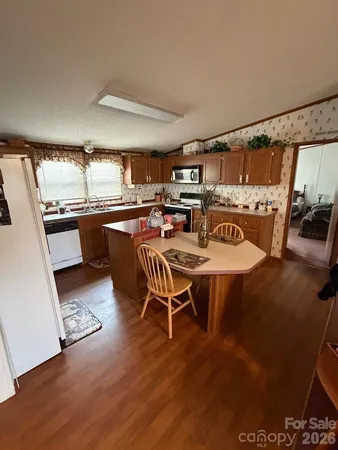 a outdoor dining space with furniture and wooden floor