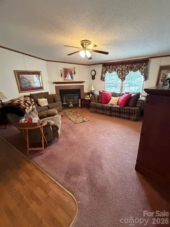 a children room with furniture and a fireplace