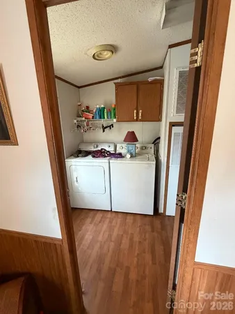 a utility room with a sink a washer and dryer