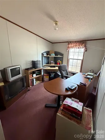 a room with furniture and a flat screen tv