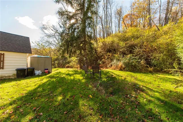 a view of yard with swimming pool