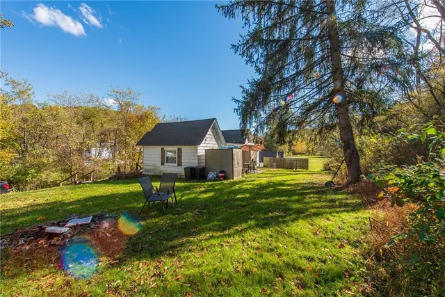 a view of a house with a big yard