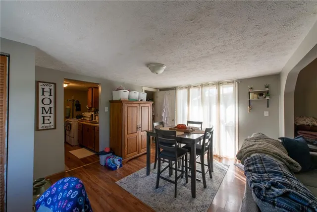 a view of a livingroom with furniture and wooden floor