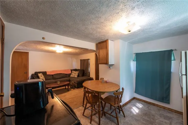 a dinning room with furniture and wooden floor