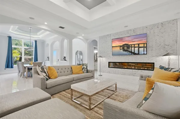 a kitchen with stainless steel appliances a stove and white cabinets