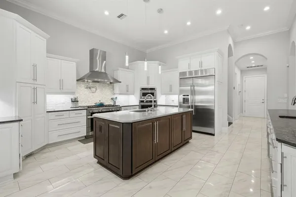 a view of a dining room with furniture and a large window