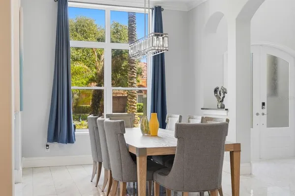 a view of a hallway with wooden floor and a floor to ceiling window