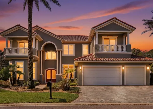 a front view of a house with a garage