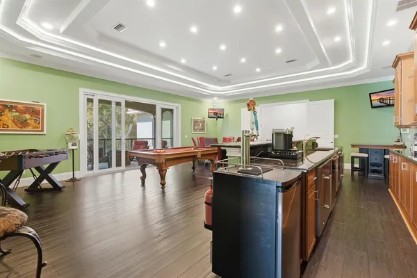 a front view of a house with a yard and trees