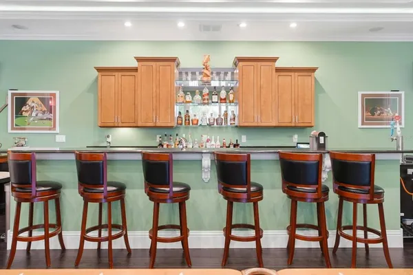 an aerial view of a house with a mountain