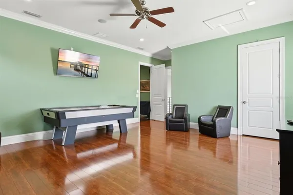 an aerial view of a house with a mountain