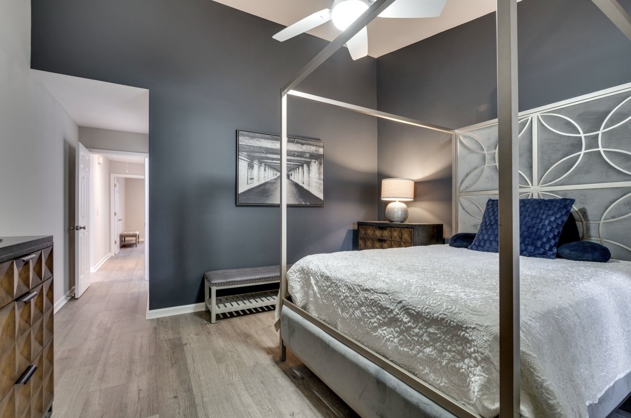 515 Upsall Drive Antioch, TN 37013 - Photo 14 of 31 a bedroom with a bed and a chandelier