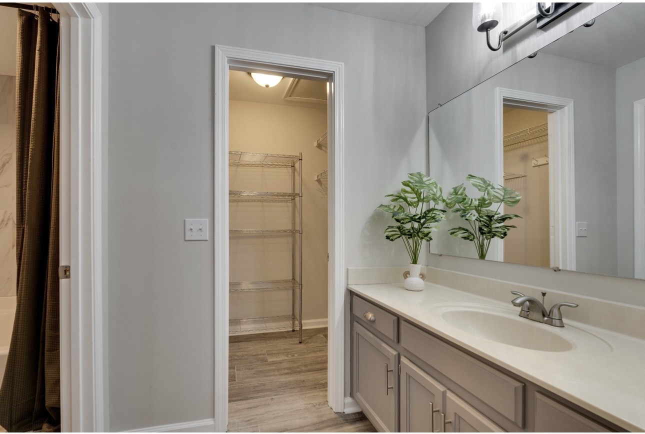 515 Upsall Drive Antioch, TN 37013 - Photo 15 of 31 a bathroom with a granite countertop sink a mirror and a shower