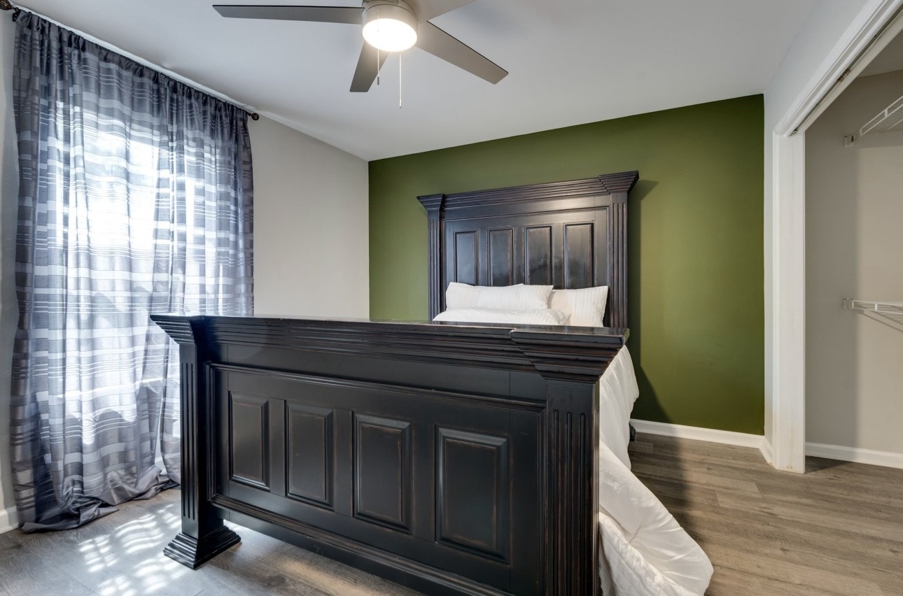 515 Upsall Drive Antioch, TN 37013 - Photo 19 of 31 a kitchen with kitchen island a sink wooden floor and a large window