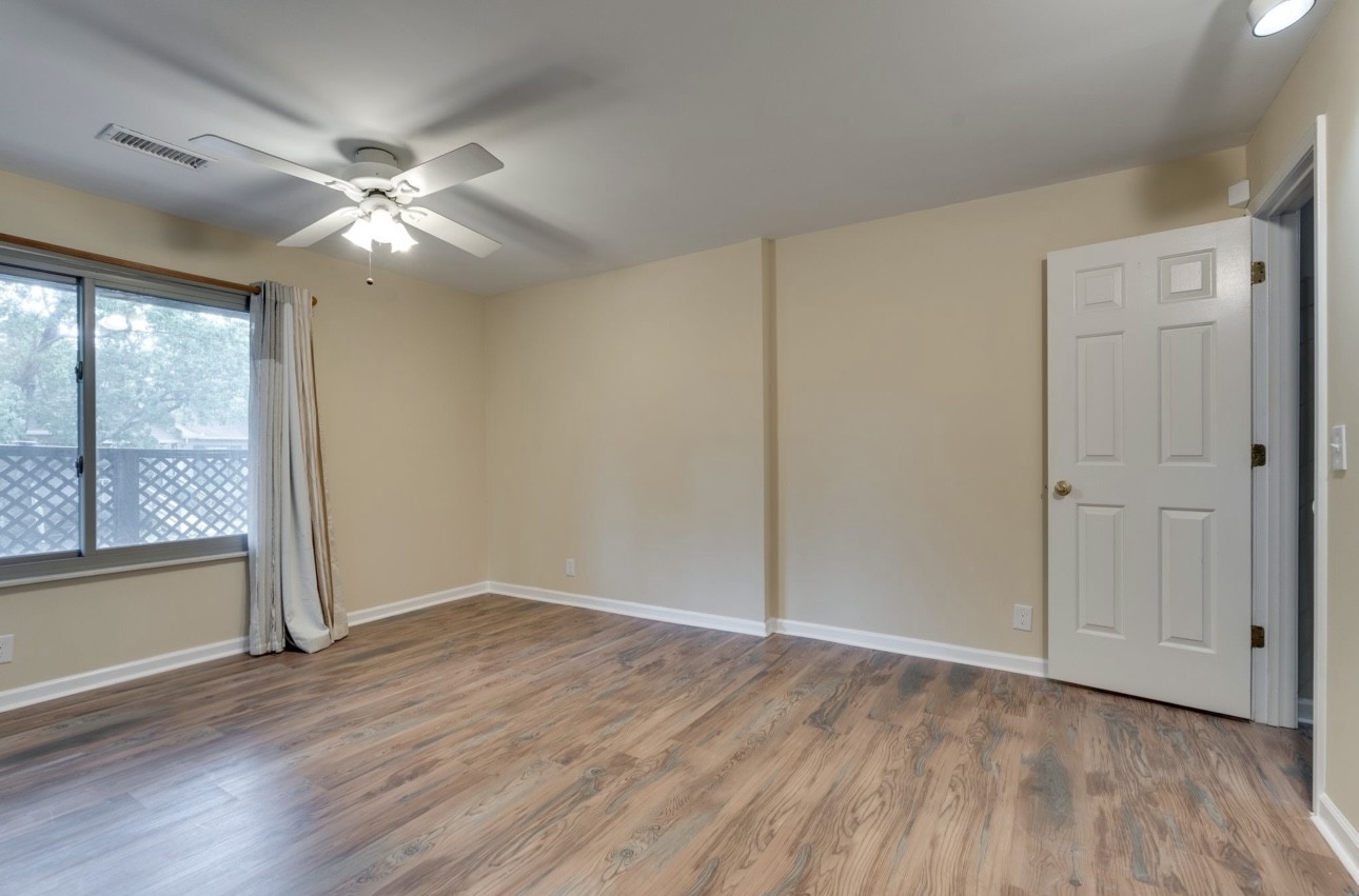 515 Upsall Drive Antioch, TN 37013 - Photo 23 of 31 an empty room with wooden floor fan and windows