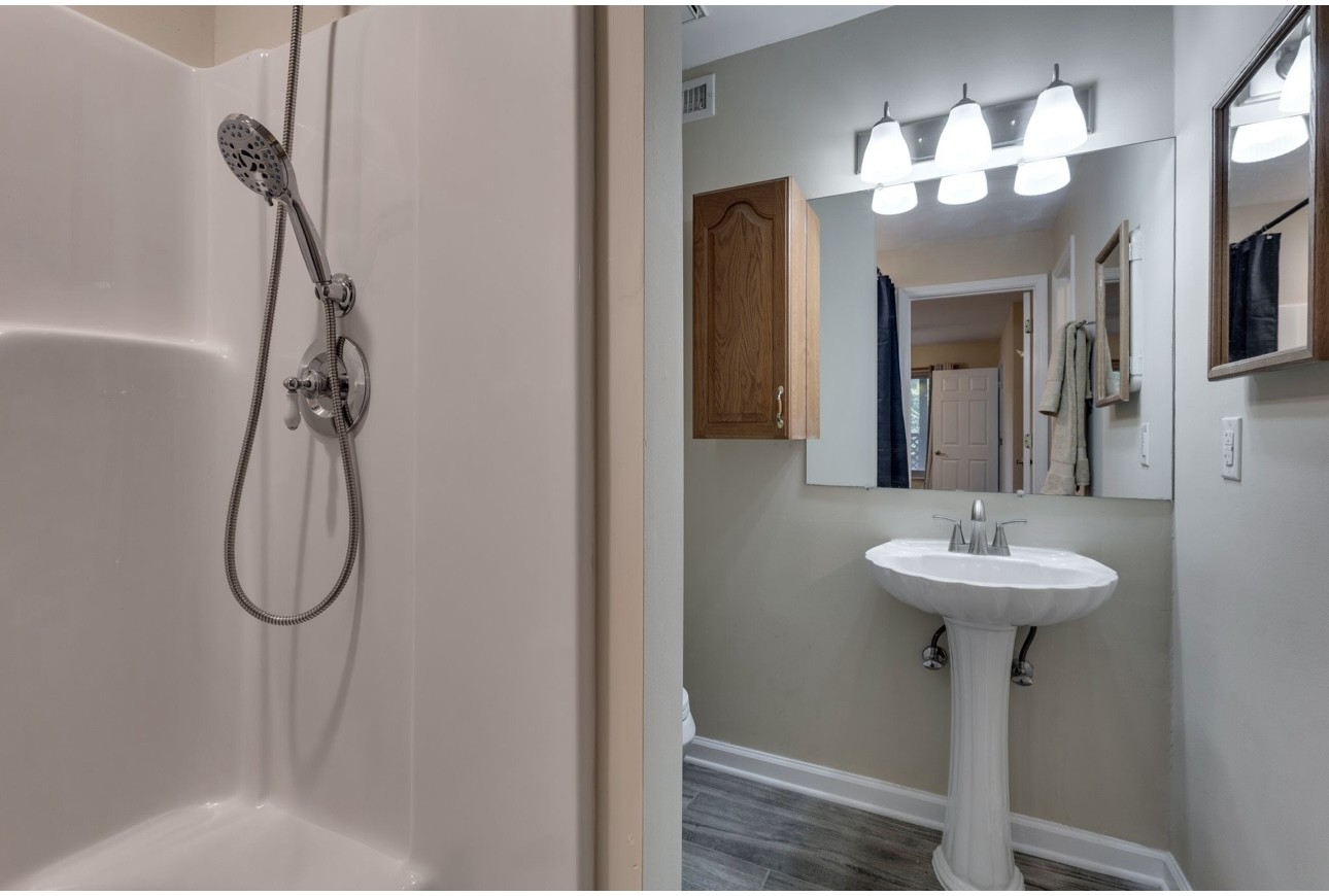 515 Upsall Drive Antioch, TN 37013 - Photo 26 of 31 a bathroom with a sink a mirror and a shower