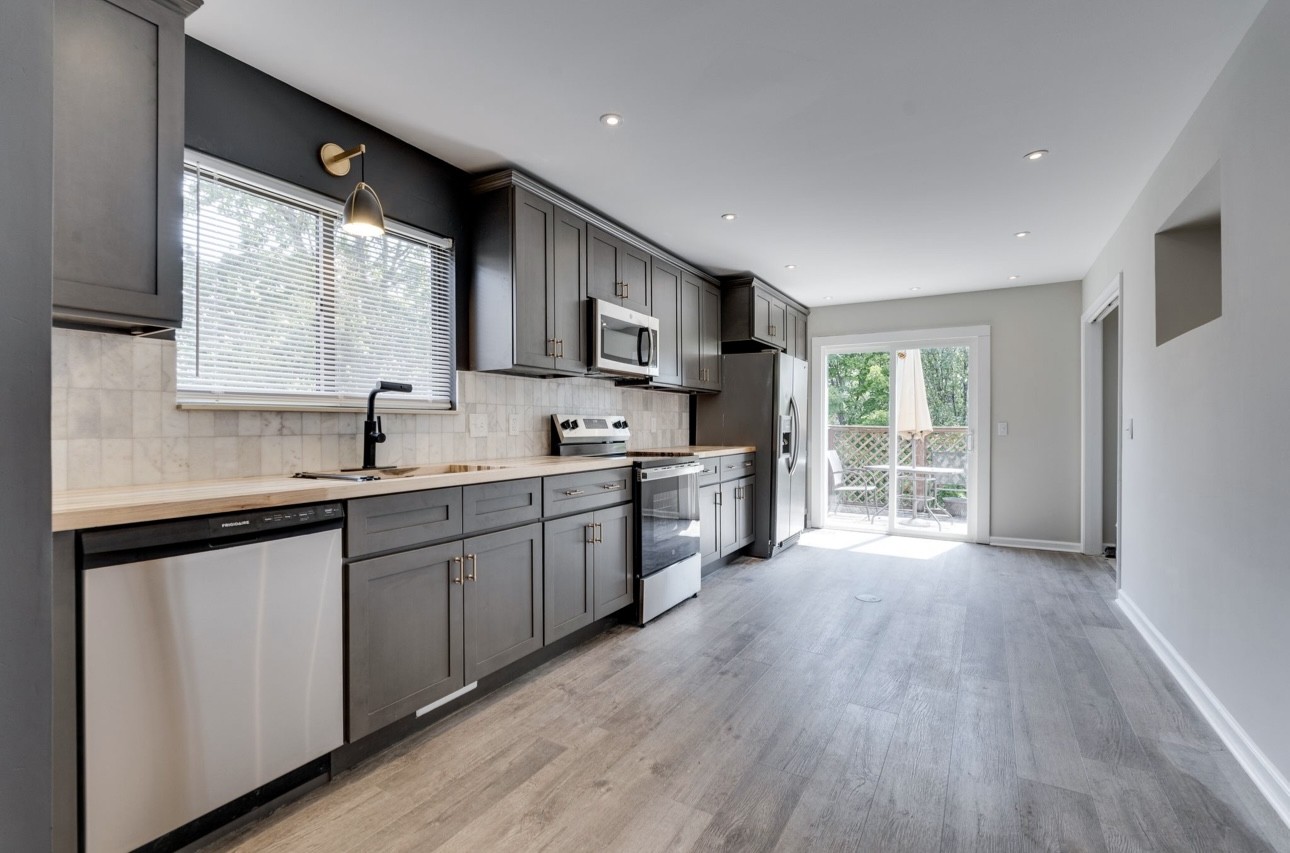 515 Upsall Drive Antioch, TN 37013 - Photo 10 of 31 a large kitchen with stainless steel appliances granite countertop a sink a stove a refrigerator a center island and cabinets