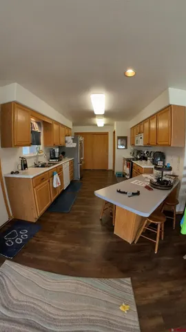 a room with furniture and a flat screen tv