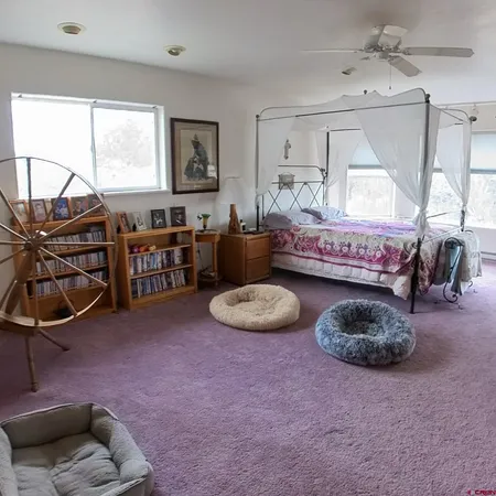 a living room with furniture a window and a fireplace