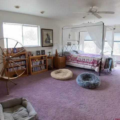 a living room with furniture a window and a fireplace