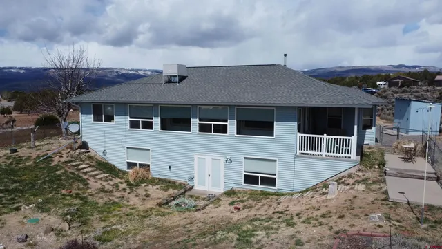 a house with trees in the background