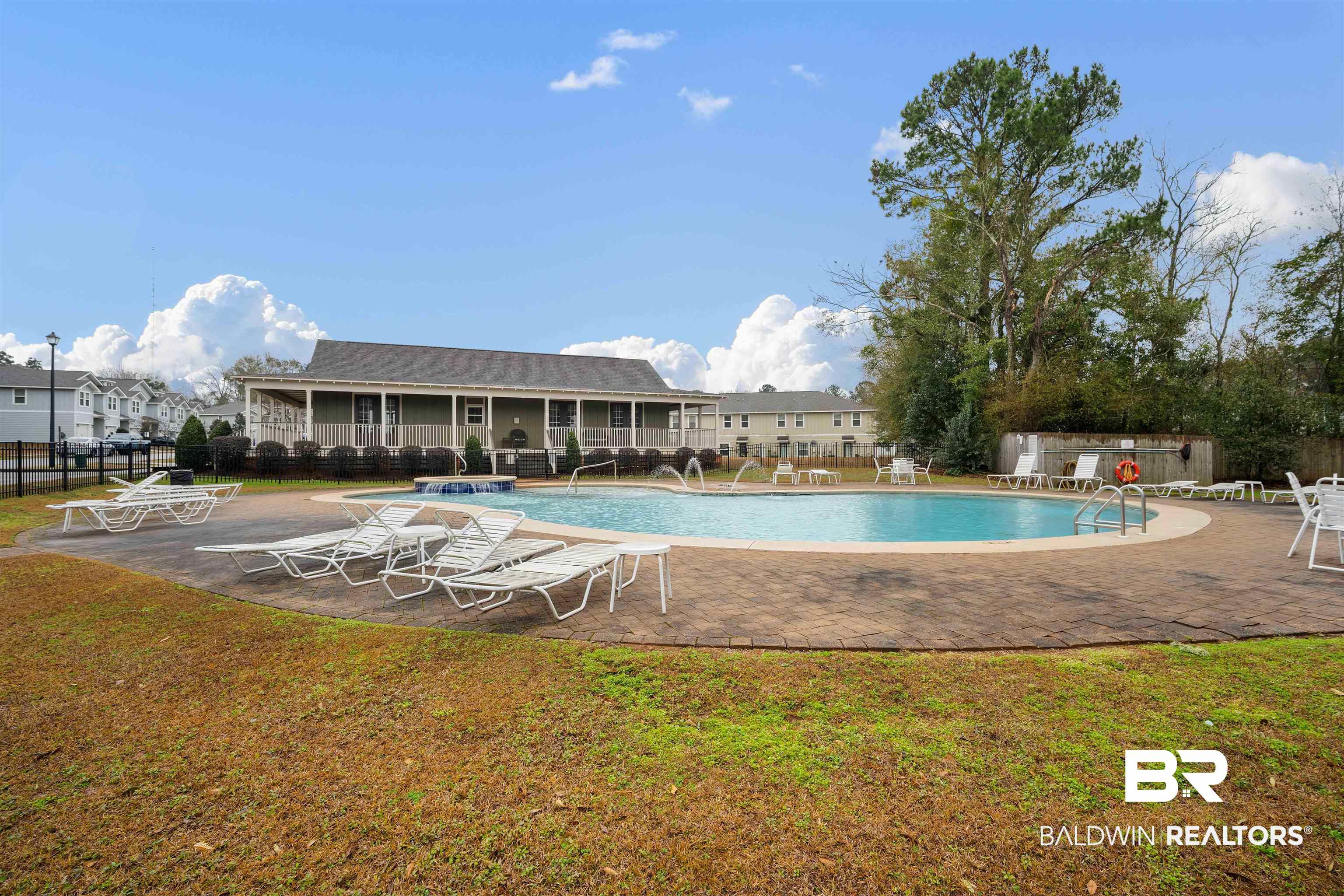 25806 Pollard Road, Unit 205 Daphne, AL 36526 - Photo 22 of 26 Community pool featuring a patio area