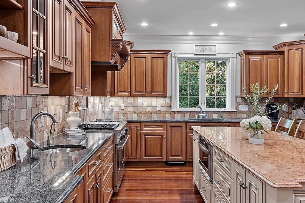 102 Claybrook Road Dover, MA 02030 - Photo 13 of 42 a kitchen with stainless steel appliances granite countertop a sink stove and cabinets