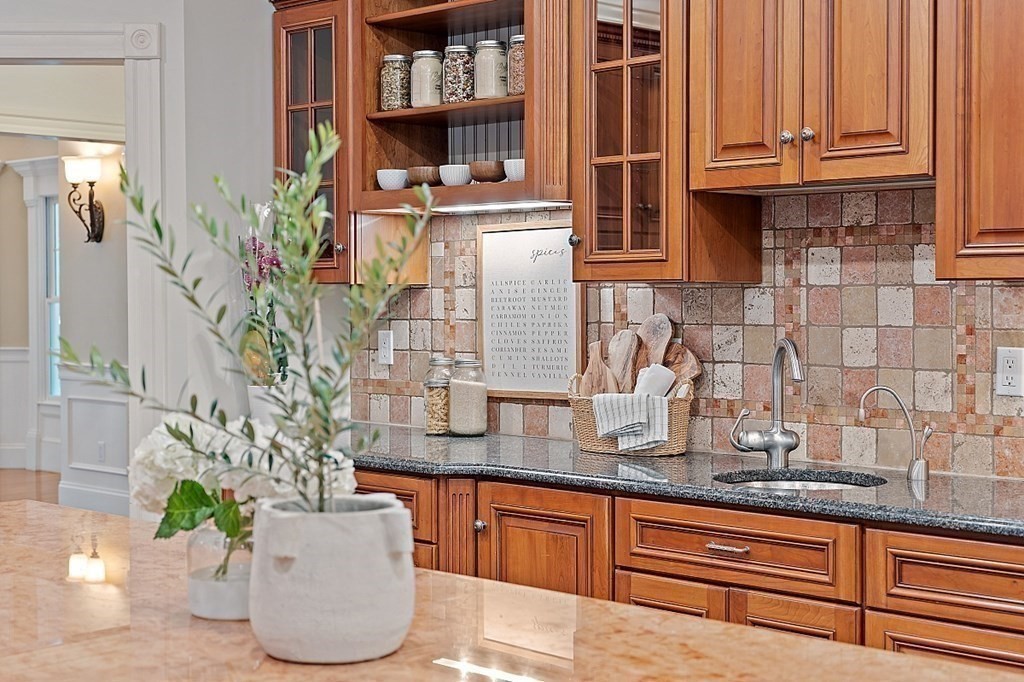 102 Claybrook Road Dover, MA 02030 - Photo 15 of 42 a kitchen with granite countertop lots of stainless steel appliances granite countertop a blue cabinets and a wooden floor