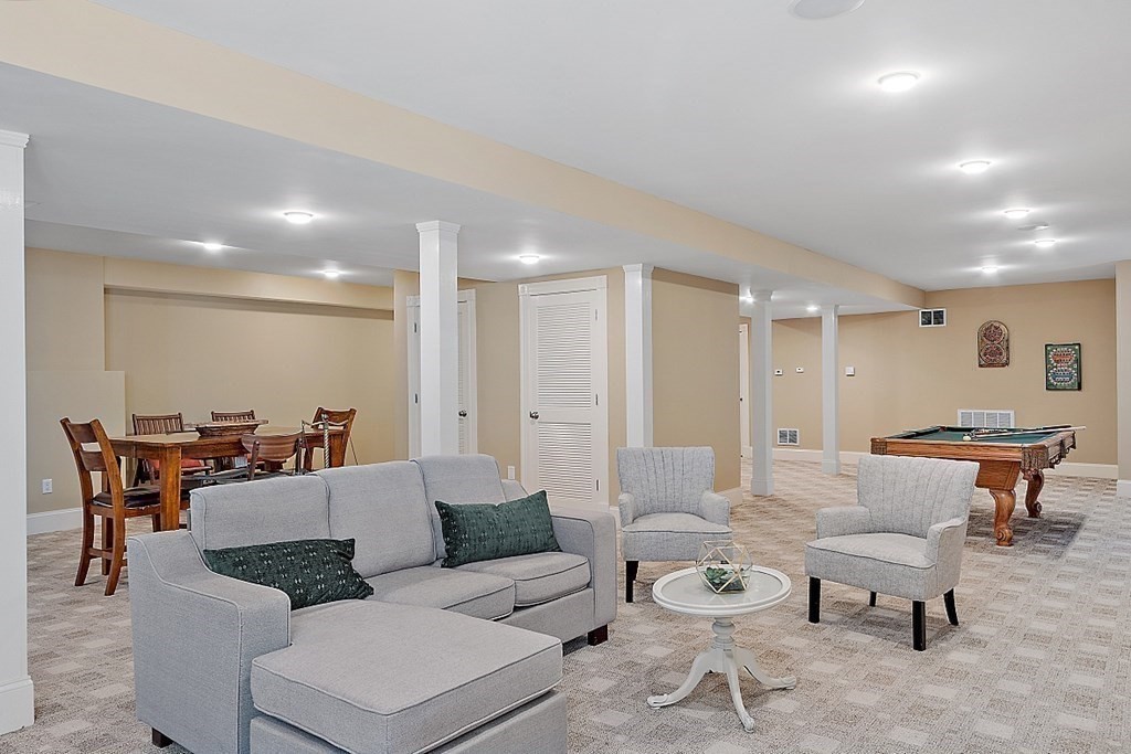 102 Claybrook Road Dover, MA 02030 - Photo 33 of 42 a living room with furniture and a table