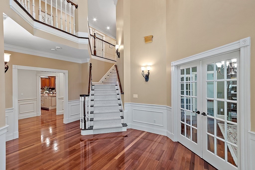 102 Claybrook Road Dover, MA 02030 - Photo 7 of 42 a view of entryway with stairs and wooden floor