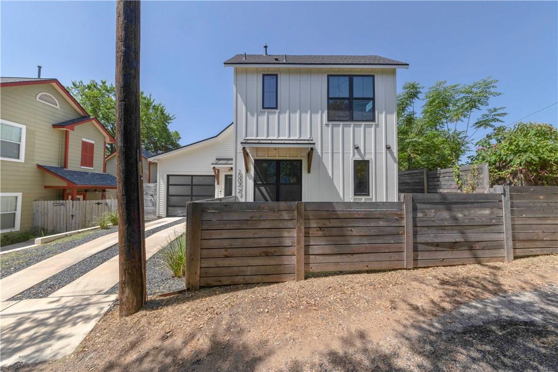 2002 East 9th Street, Unit 2 Austin, TX 78702 - Photo 1 of 32 A modern two-story home with a board and batten facade and an integrated garage.