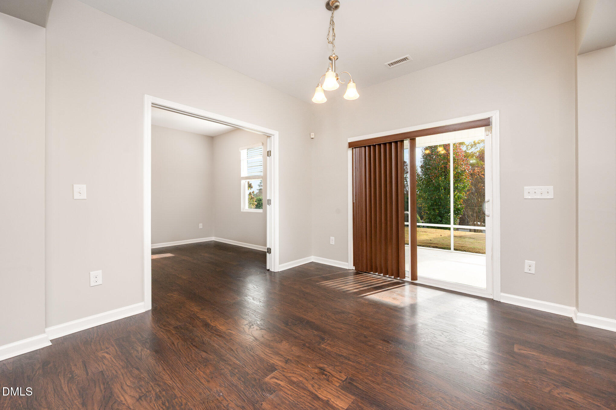 18 Dover Ridge Court Chapel Hill, NC 27517 - Photo 15 of 40 an empty room with wooden floor and windows