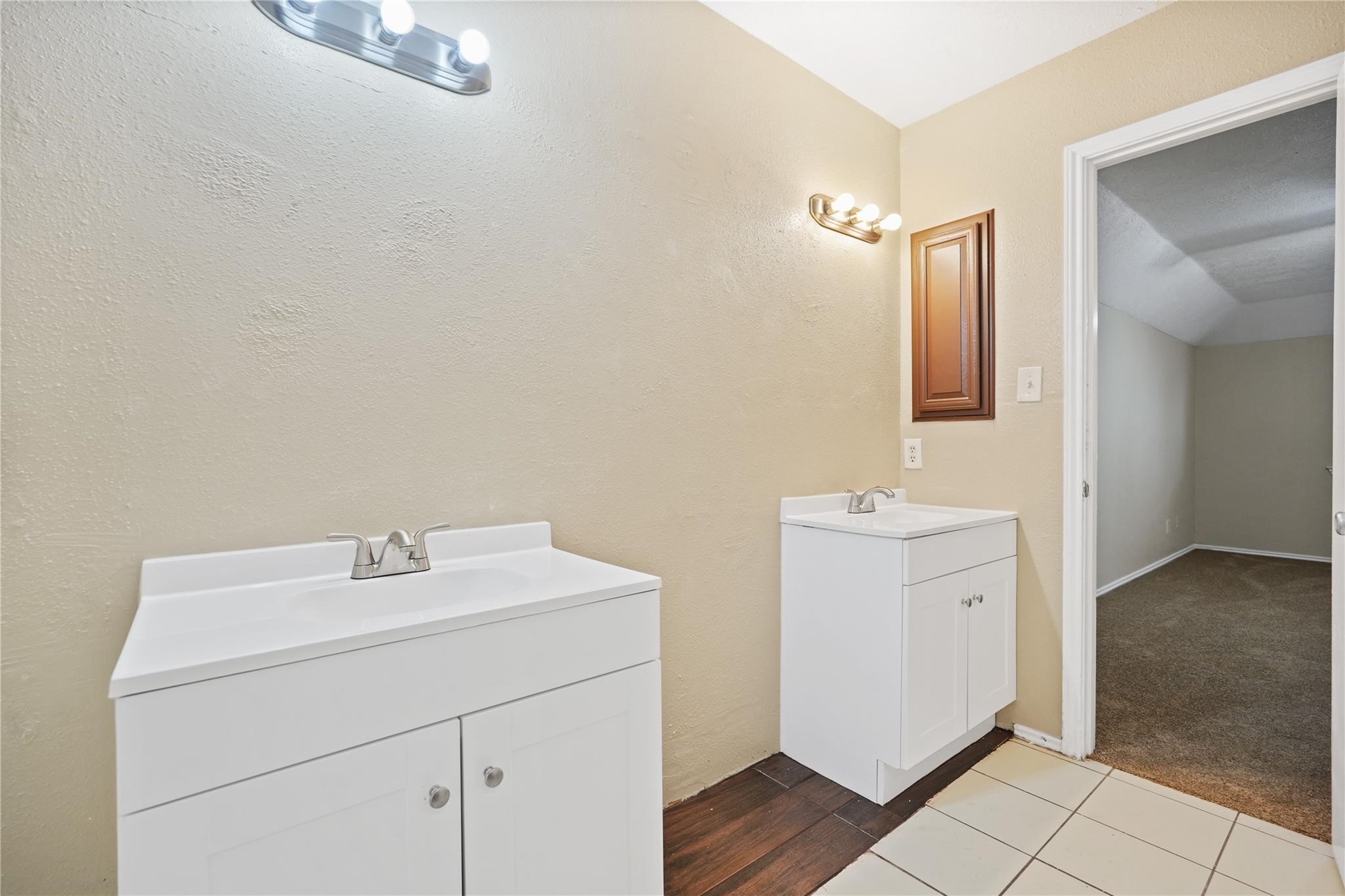 22911 Sherioaks Lane Spring, TX 77389 - Photo 11 of 22 a bathroom with a sink a vanity and a mirror